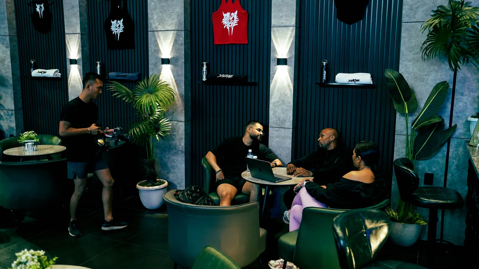 Members seated in the Savage lounge and reception area