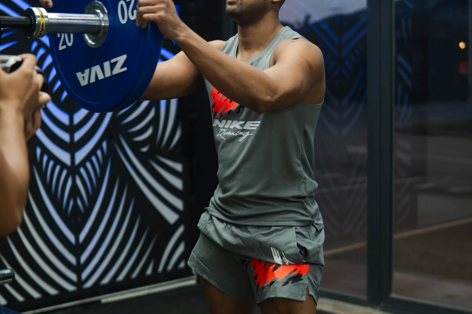 Savage coach holding pads during a one-to-one session
