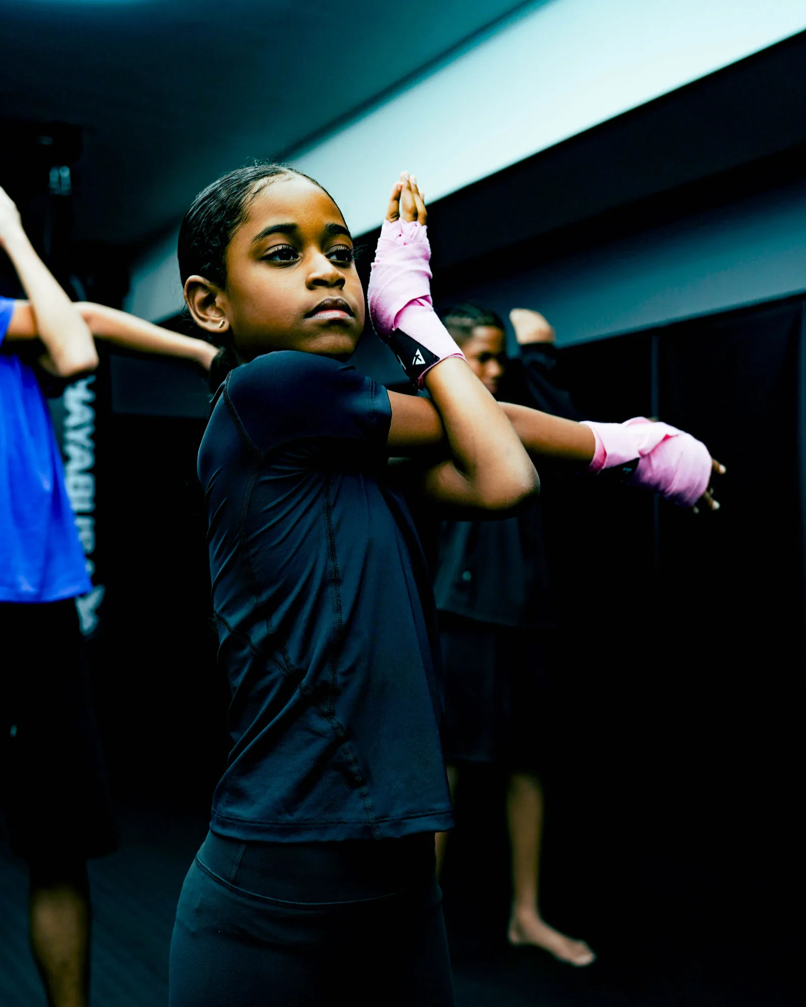 Young Savages student practising a guard position in class